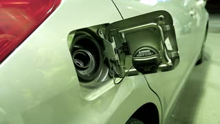 Filling Up Car Gas Tank With Fuel At Station Closeup On Hand And Pump With 4k Resolution Nf6yh6t8x S0000 1