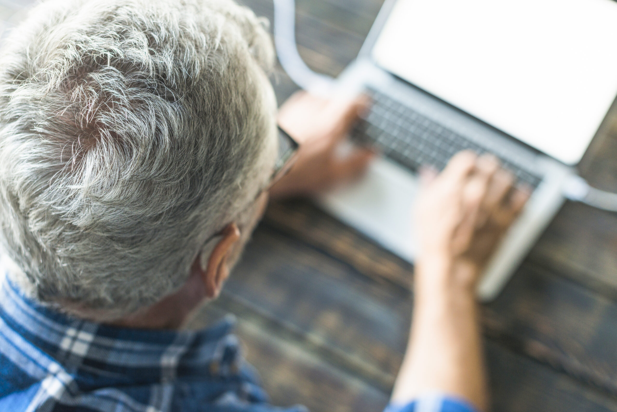 Overhead View Senior Man Using Laptop